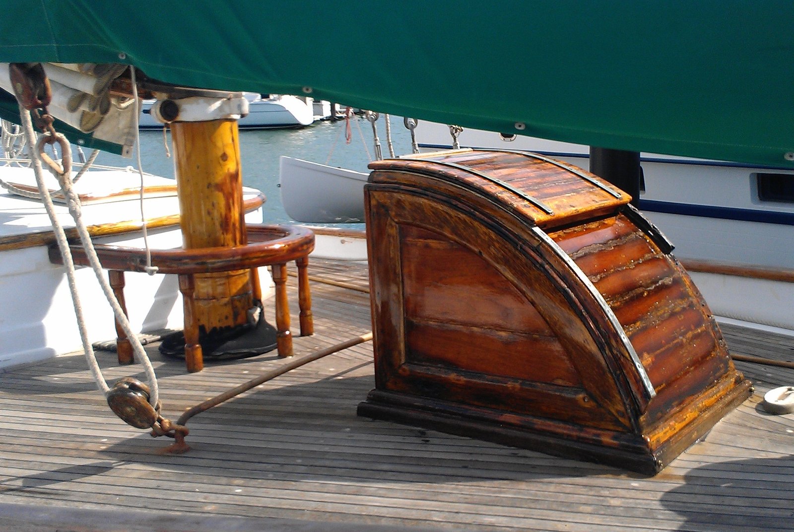 Yankee's foredeck detail showing varnished companionway hatch